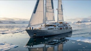 Oceanwide Expeditions' new hybrid eco-sail expedition ship navigating icy polar waters.