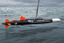 A sleek SeaCat vessel from TKMS Group cruises on the open water.