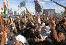 A large container ship sails on open waters, symbolizing Red Sea shipping concerns.