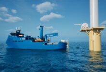 Workers assemble large maritime battery modules inside a Corvus Energy factory.