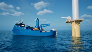 Workers assemble large maritime battery modules inside a Corvus Energy factory.
