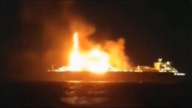 Russian LNG carrier Arctic Metagaz ablaze at sea, emitting smoke.