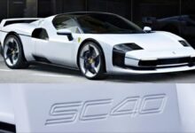 The sleek red Ferrari SC40, a modern homage to the F40, parked outdoors.