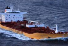 A Stolt-Nielsen chemical tanker vessel sailing on the ocean.