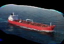 A Handymax tanker vessel sailing on the open sea, related to Scorpio Tankers.