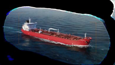 A Handymax tanker vessel sailing on the open sea, related to Scorpio Tankers.