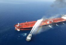 Tanker MT Front Altair shows smoke and hull damage after an attack.