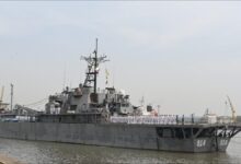 The Iranian Navy amphibious vessel IRIS Lavan sailing on the water.