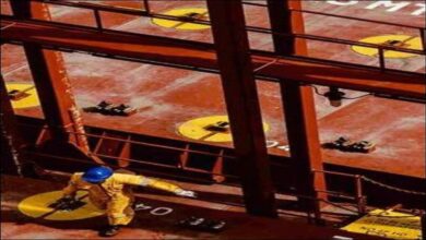 A Hapag-Lloyd container ship sails on the ocean, symbolizing global freight shipments.