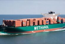 A large container ship at sea, illustrating global maritime shipping and trade.