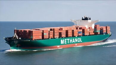 A large container ship at sea, illustrating global maritime shipping and trade.