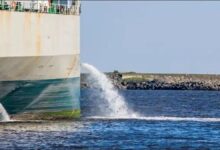 A complex Ballast Water Treatment System (BWTS) with pipes and controls on a vessel.