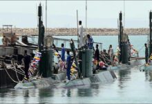 A warship patrols vital shipping lanes, relevant to Iran's sea mine strategy.