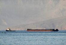 A large oil tanker navigates the strategic Strait of Hormuz.