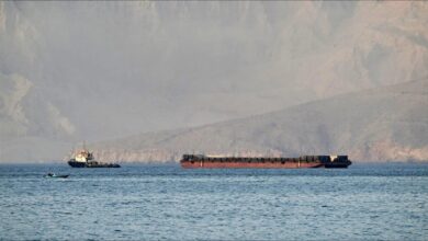 A large oil tanker navigates the strategic Strait of Hormuz.