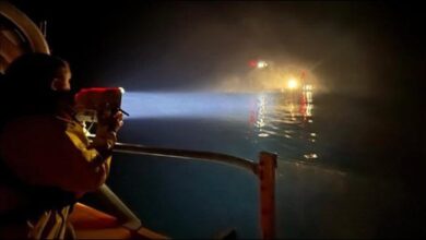 An RNLI lifeboat and crew conduct a critical medical evacuation at sea.