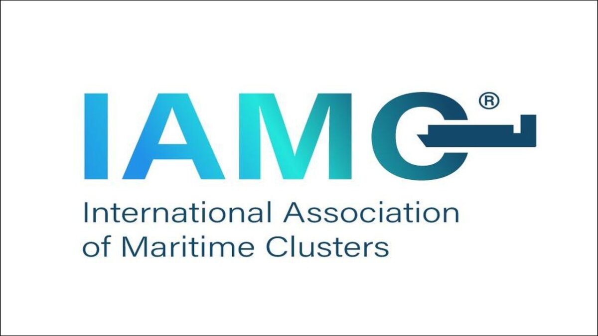The IAMC logo features a world map graphic on a blue background.