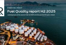 A large marine vessel receiving fuel from a bunkering ship in Singapore.