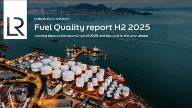 A large marine vessel receiving fuel from a bunkering ship in Singapore.