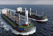 Ultramax bulk carrier with Anemoi's wind-assisted Flettner rotor propulsion system at sea.