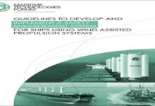 A modern cargo ship with large rigid sails for wind-assisted propulsion.