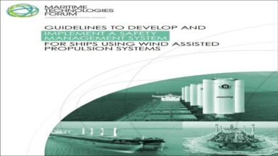 A modern cargo ship with large rigid sails for wind-assisted propulsion.