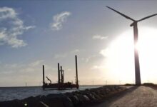 A Fugro survey vessel conducts offshore geotechnical work in a calm blue sea.