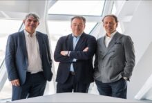 Container ships and cranes at the busy Port of Antwerp-Bruges.