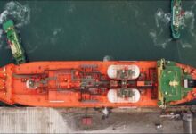 A Navigator Gas liquefied gas carrier vessel sails through calm waters.