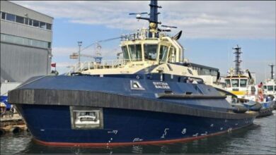 The Svitzer Balder battery-methanol tug sailing on calm waters.