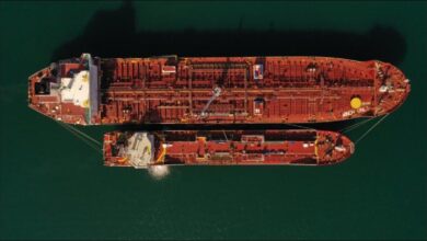 Two large tankers conducting a ship-to-ship transfer operation at Portland Port.