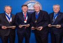 Captain John W. Murray accepts his award during induction into the Maritime Hall of Fame.