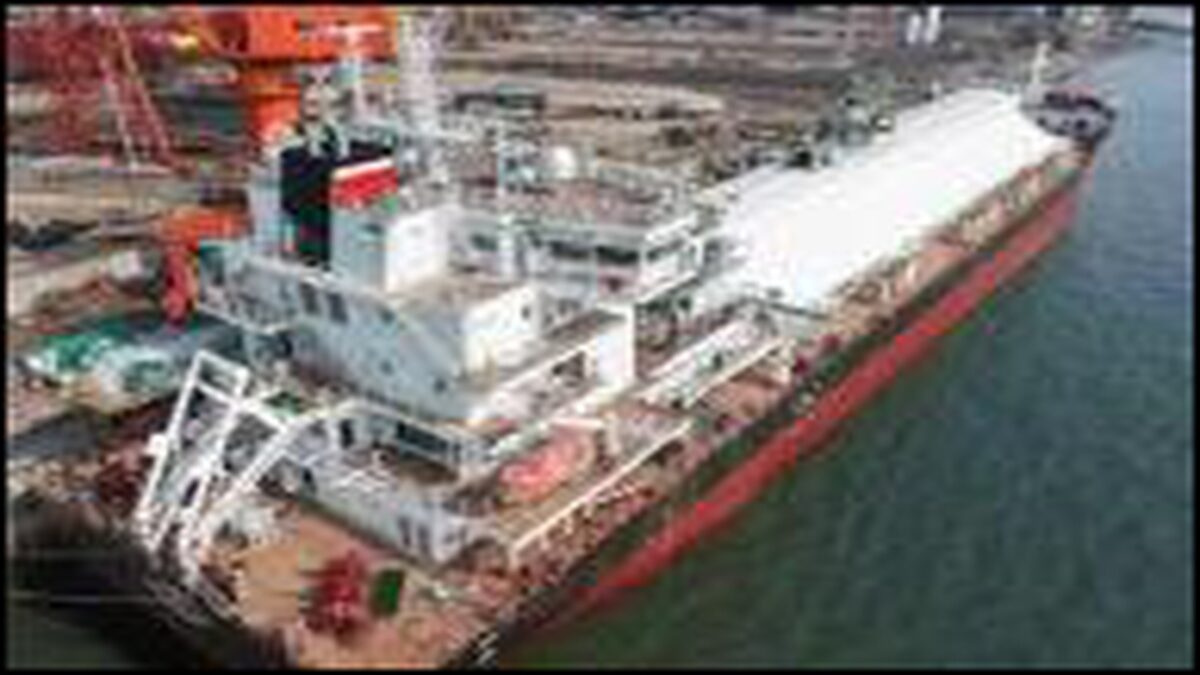 An X-Press Feeders container ship sails on the open ocean.