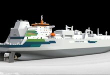 Modern cargo vessel at sea equipped with a carbon capture system.