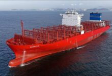 The Navios Cyan, a new LNG/methanol-ready container ship sailing at sea.