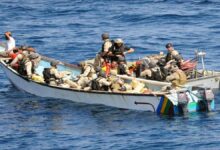 A large cargo vessel navigates the open ocean near the coast of Somalia.