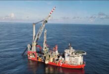 A Subsea7 offshore vessel on calm blue waters.