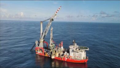 A Subsea7 offshore vessel on calm blue waters.