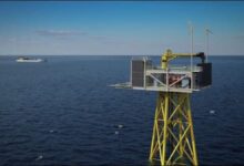 The Trudvang unmanned wellhead platform on a carrier vessel in the North Sea.