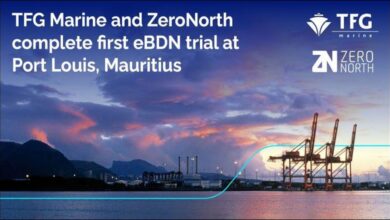 Professionals use a tablet for e-BDN in a Mauritius port, symbolizing digital bunker delivery.