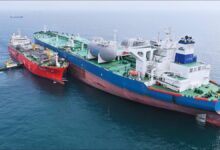 A dry bulker vessel receives LNG fuel during a bunkering operation in Hong Kong.