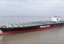 A large Hapag-Lloyd container ship at sea, representing methanol conversion.