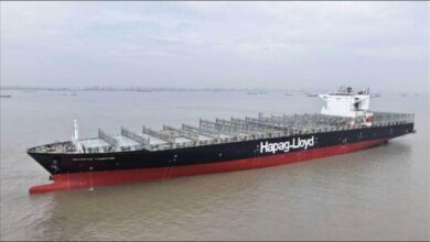 A large Hapag-Lloyd container ship at sea, representing methanol conversion.