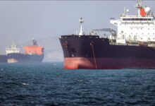 A large oil tanker sails on open waters, reflecting maritime tensions.