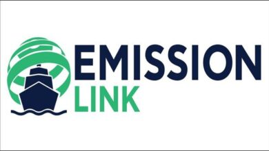 A container ship overlaid with digital graphics showing carbon emissions data for strategic management.