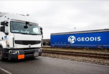 Geodis logistics terminal with freight containers and trucks in Le Havre.