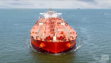 A huge crude oil tanker docked, likely loading oil for US exports.