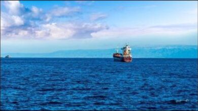 A large oil tanker sails through open waters, representing global crude oil transport.