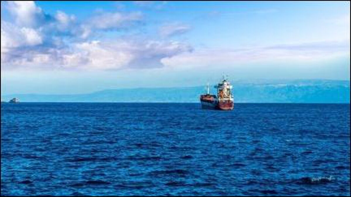 A large oil tanker sails through open waters, representing global crude oil transport.