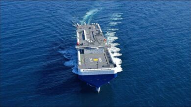 An NYK car carrier ship sails on the ocean, advancing sustainable shipping.